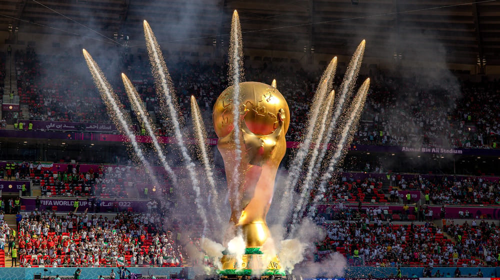 Giant World Cup with fireworks going off around it
