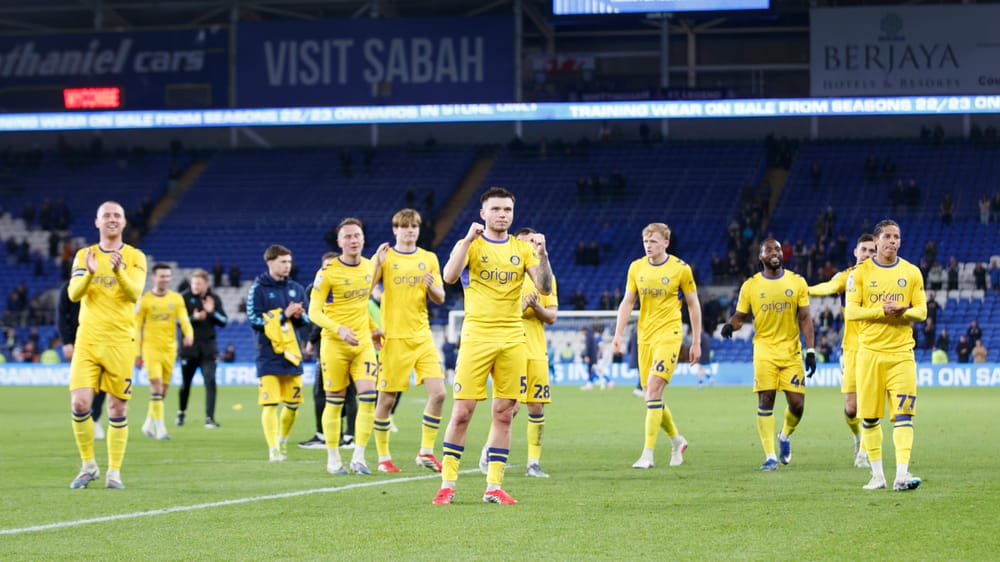Wycombe Wanderers players applaud fans against Cardiff City