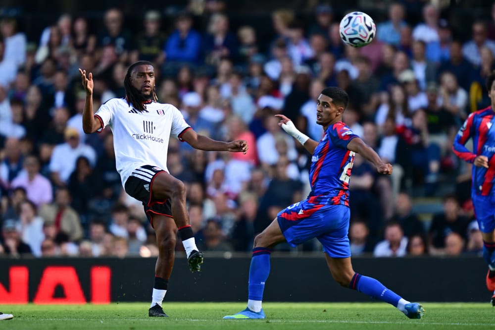 Fulham forward Alex Iwobi (17) looks to release the ball under pressure from Crystal Palace defender Anan Khalaili (25) during the Premier League match between Fulham and Crystal Palace at Craven Cottage, London, UK on 5 September 2026.