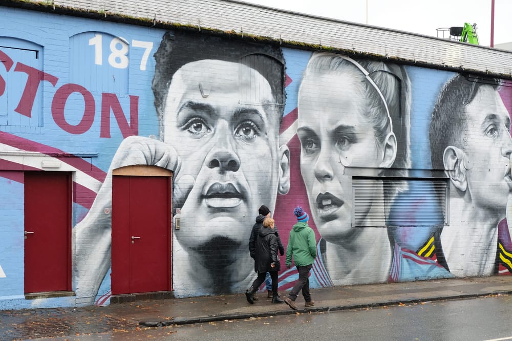 Mural outside Villa Park showing Ollie Watkins, Rachel Daly and Emiliano Martinez