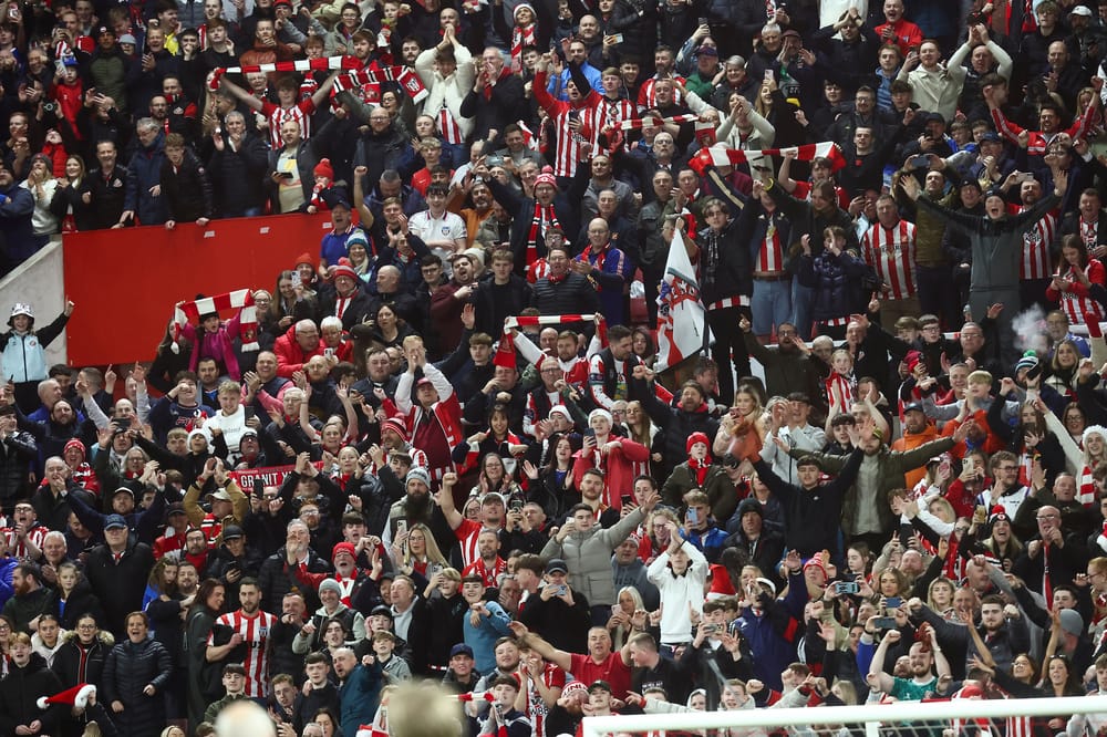 Sunderland fans celebrate during the Premier League match between Sunderland and Newcastle United at the Stadium Of Light, Sunderland, England on 14 December 2025.