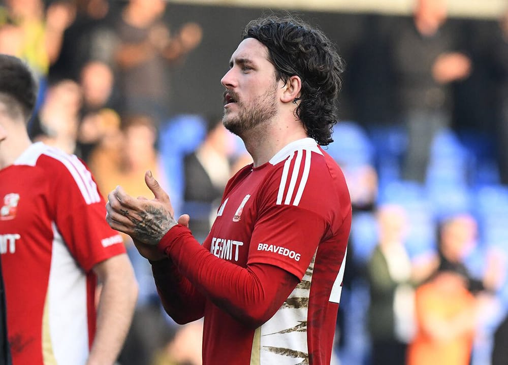 Darren Oldaker claps Swindon Town fans after victory at Tranmere Rovers